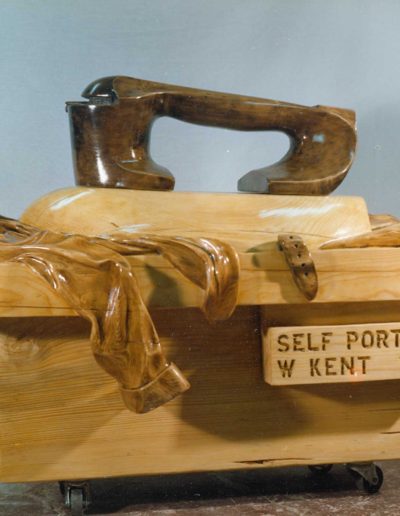 "Self-Portrait with Iron" 1984 STAINED SPRUCE & MAPLE, 48" x 63" x 38"